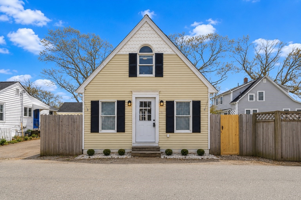 8 Cottage Street Wareham, MA 02571 - Photo 1 of 30 a front view of a house with a garage