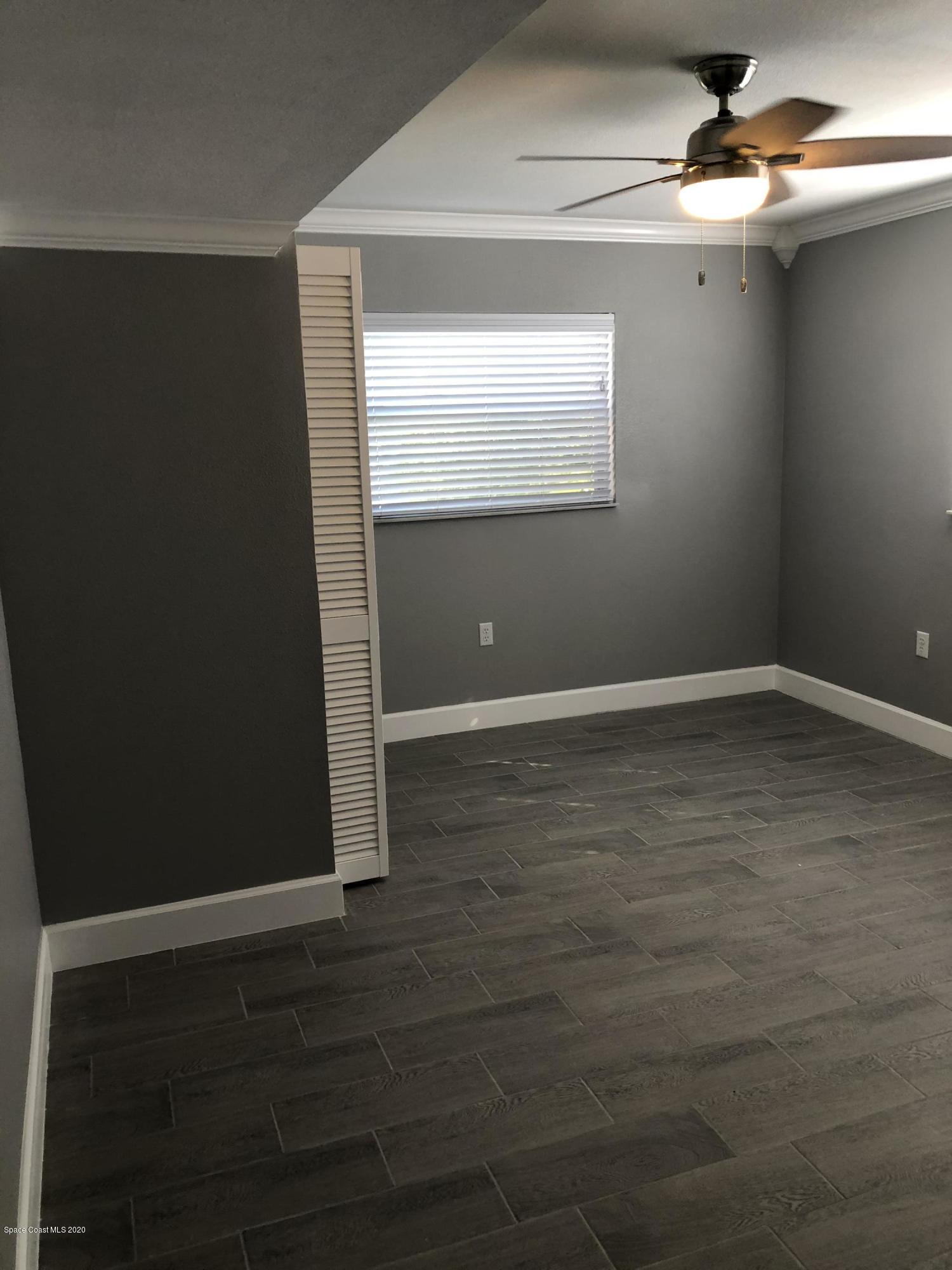 420 Monroe Avenue, Unit 101 Cape Canaveral, FL 32920 - Photo 12 of 35 a view of room with window