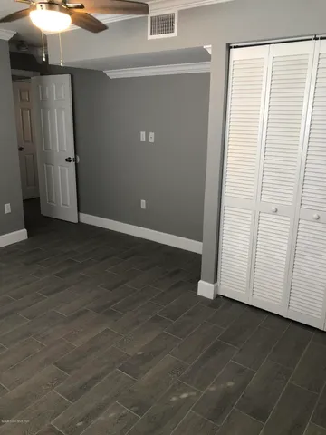 an empty room with wooden floor