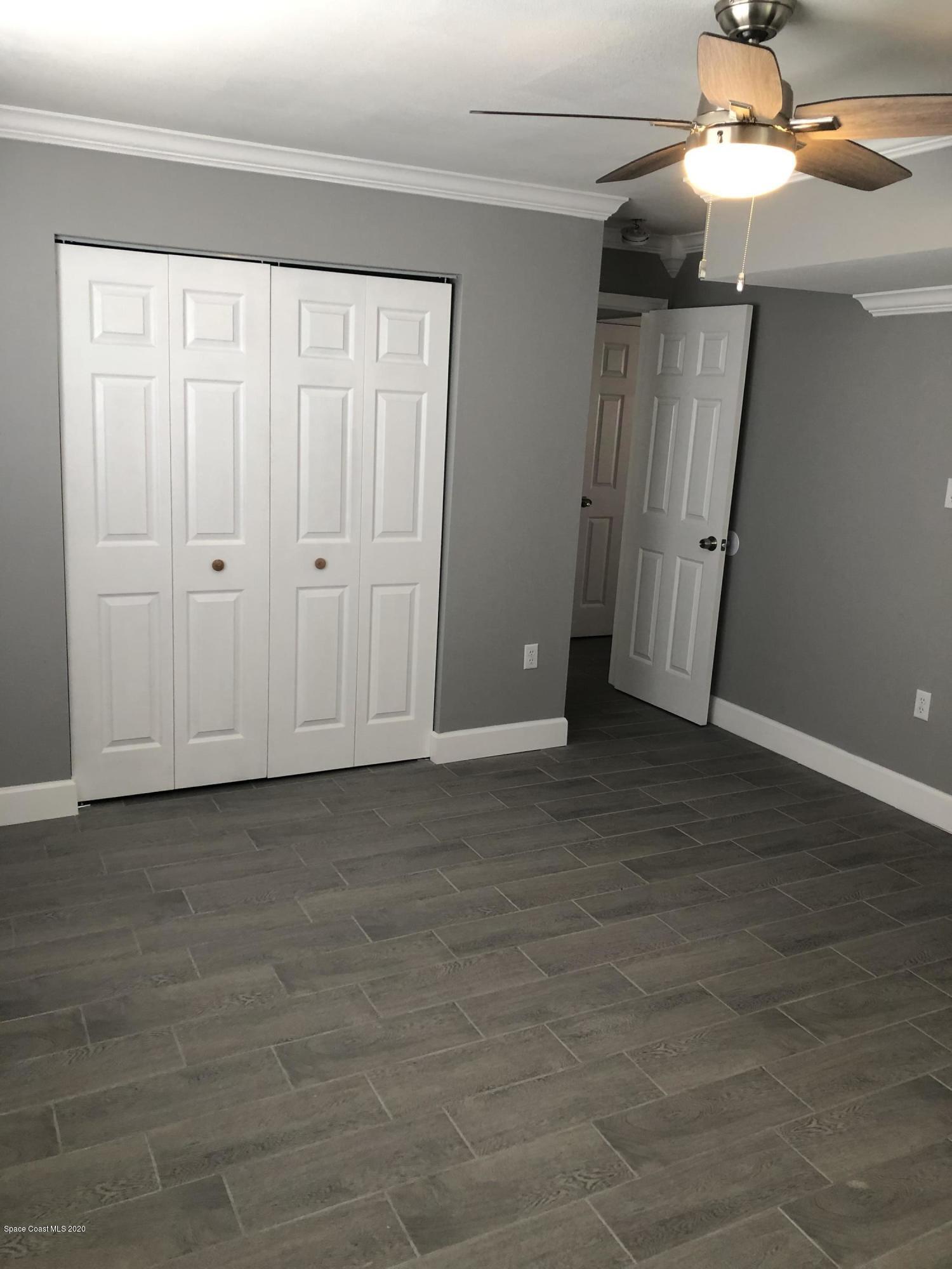 420 Monroe Avenue, Unit 101 Cape Canaveral, FL 32920 - Photo 16 of 35 a view of an empty room with a window