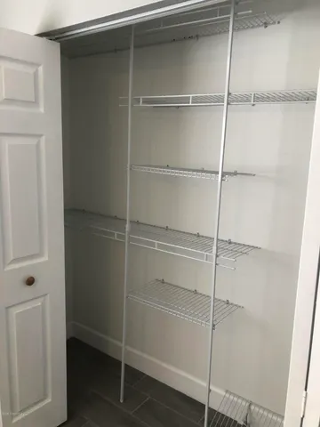 a empty closet with white paint