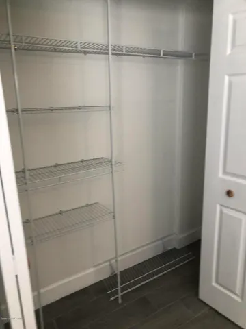 a view of an empty walk in closet