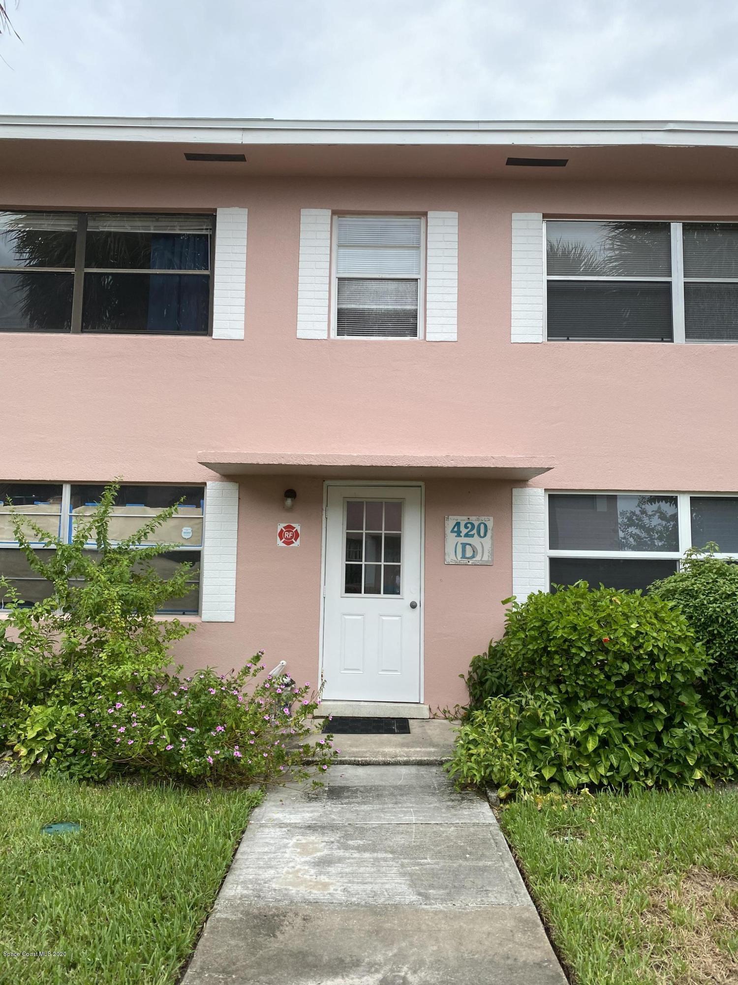 420 Monroe Avenue, Unit 101 Cape Canaveral, FL 32920 - Photo 2 of 35 a front view of a house