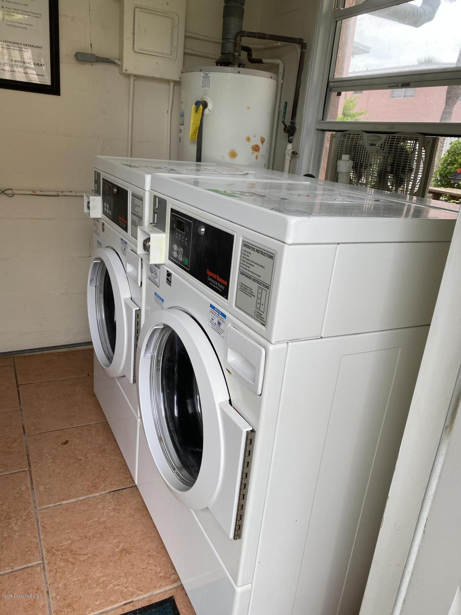 420 Monroe Avenue, Unit 101 Cape Canaveral, FL 32920 - Photo 29 of 35 a utility room with dryer and washer