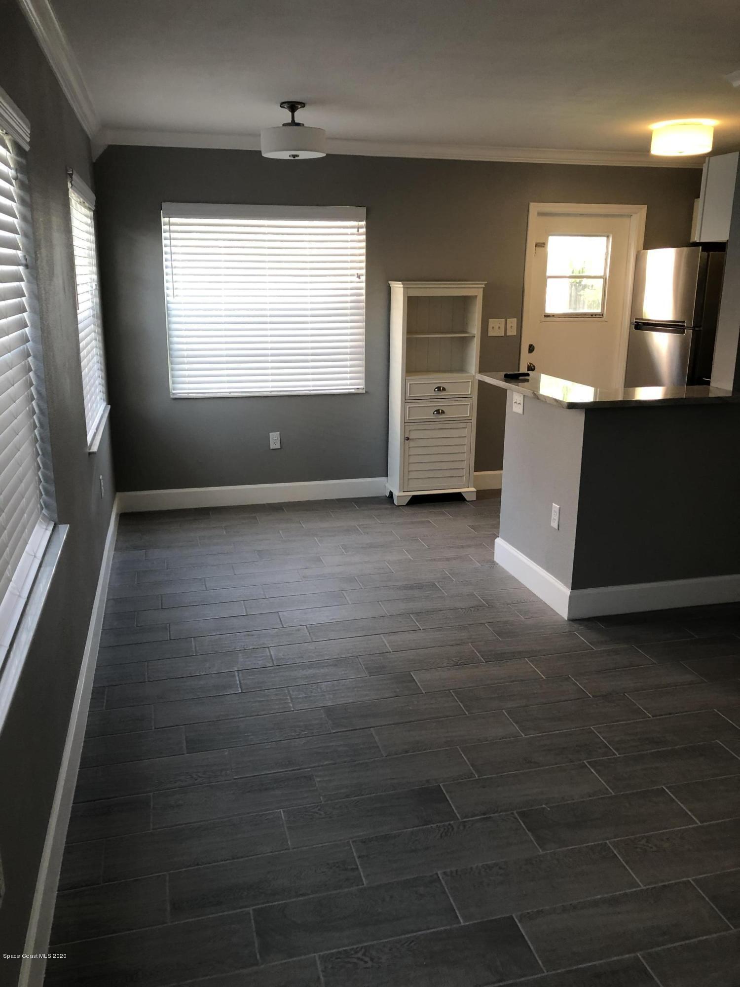 420 Monroe Avenue, Unit 101 Cape Canaveral, FL 32920 - Photo 4 of 35 an empty room with windows and closet