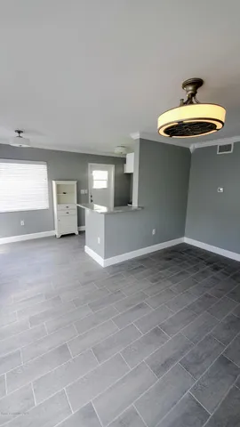 a view of a livingroom with a kitchen