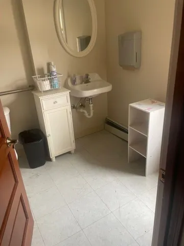 a bathroom with a sink and a mirror