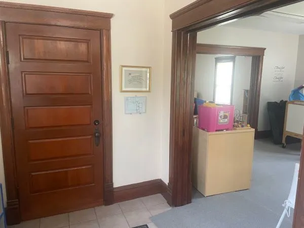 a room with furniture a window and a ceiling fan