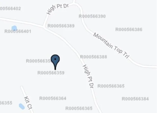 a picture of a book and a white bed