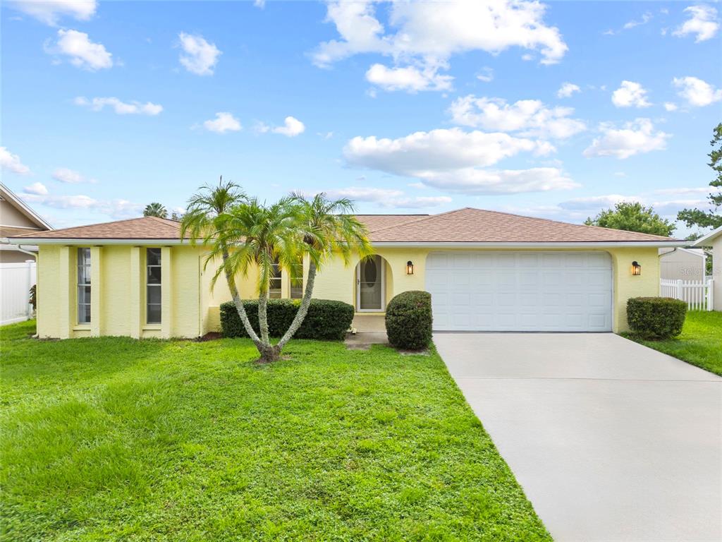 4371 Otter Way New Port Richey, FL 34653 - Photo 1 of 1 a view of a house with backyard and a tree