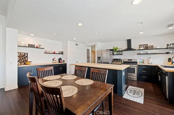 a view of kitchen with cabinets and wooden floor