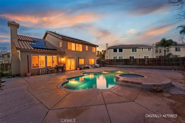 a swimming pool with outdoor seating