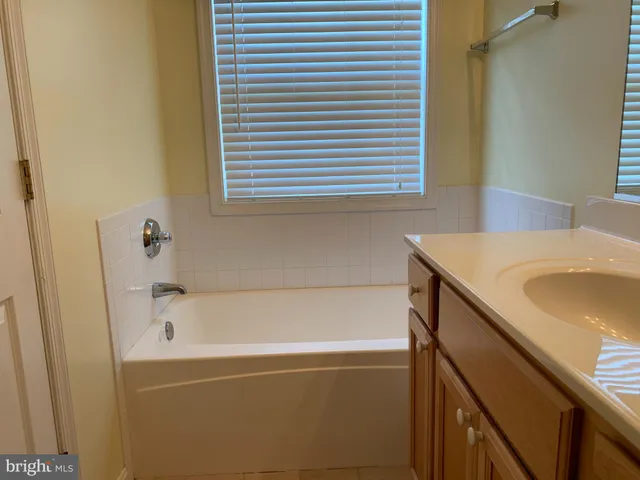 a view of balcony with table and chairs