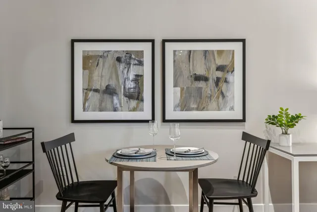 a view of a dining room with furniture wooden floor and a window