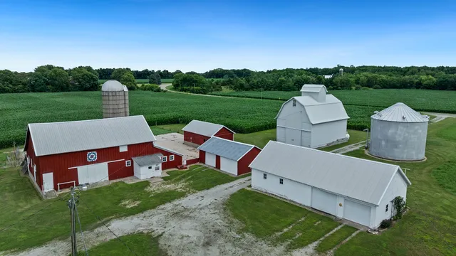 an aerial view of a house with big yard