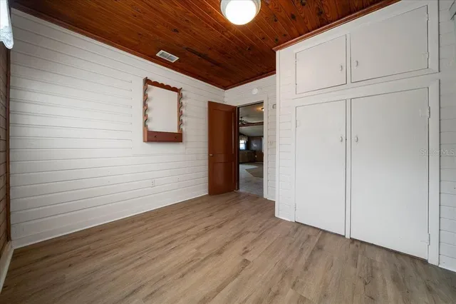 a view of a room with wooden walls