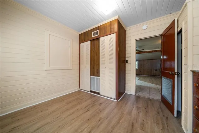 a view of a backyard with a garden and entertaining space