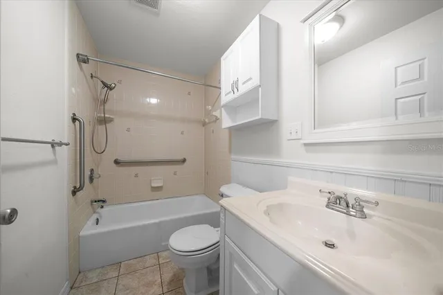 an aerial view of a house with yard swimming pool and outdoor seating