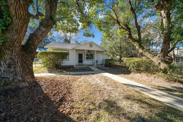 a front view of a house with yard