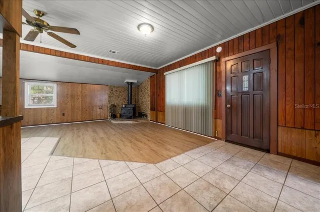a view of hallway with wooden floor