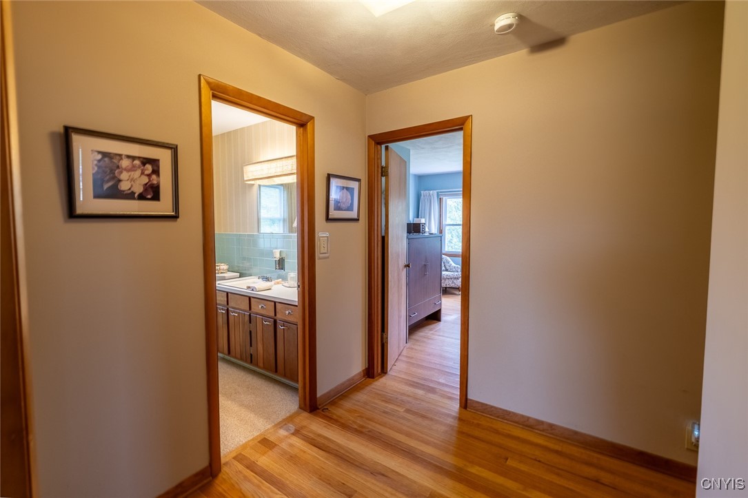 5157 Orangeport Road Clay, NY 13029 - Photo 17 of 43 Hallway to Primary and Full Bath