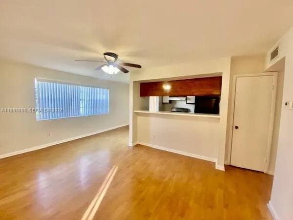 a view of a kitchen with a dishwasher and a refrigerator