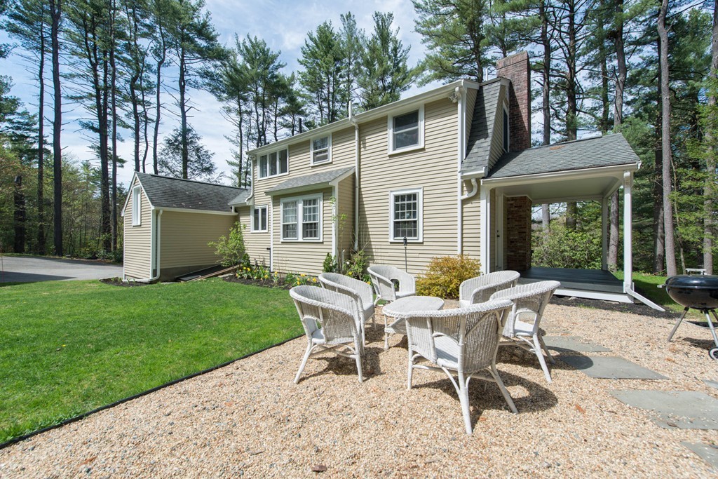9 Legion Road Weston, MA 02493 - Photo 11 of 30 a view of a house with backyard and porch