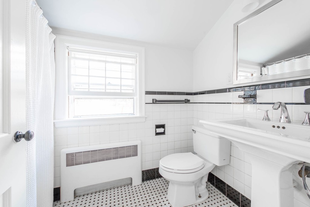 9 Legion Road Weston, MA 02493 - Photo 15 of 30 a bathroom with a sink toilet and shower