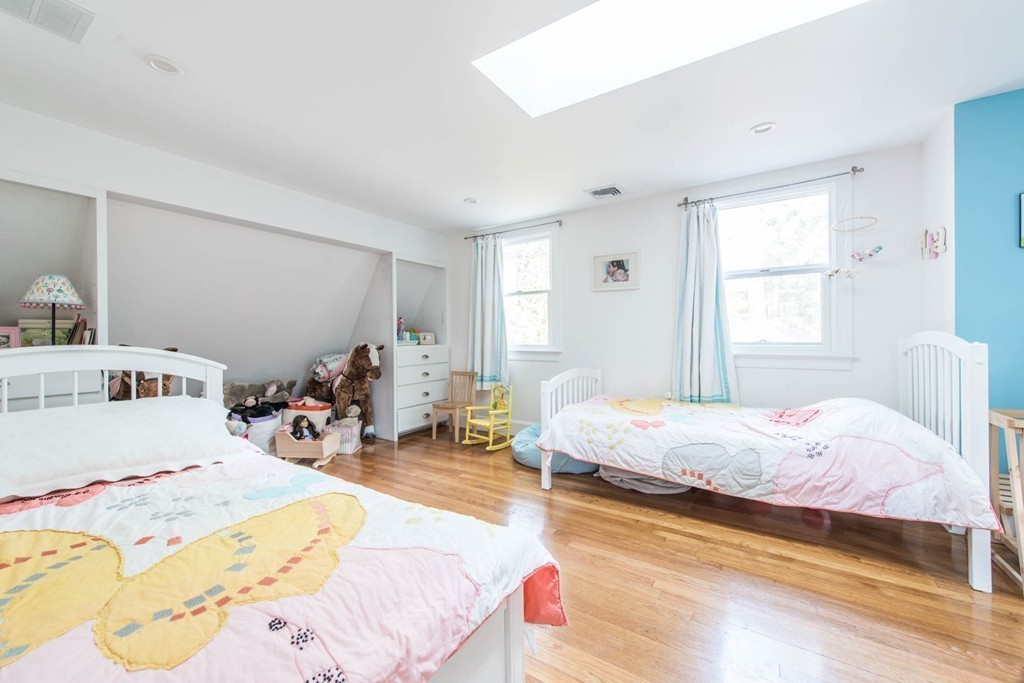 9 Legion Road Weston, MA 02493 - Photo 16 of 30 a bed room with a bed and a chair