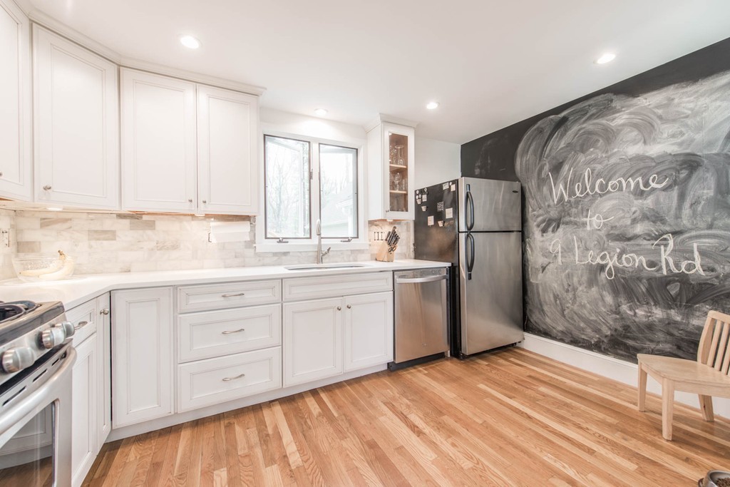 9 Legion Road Weston, MA 02493 - Photo 18 of 30 a kitchen with a refrigerator sink and cabinets