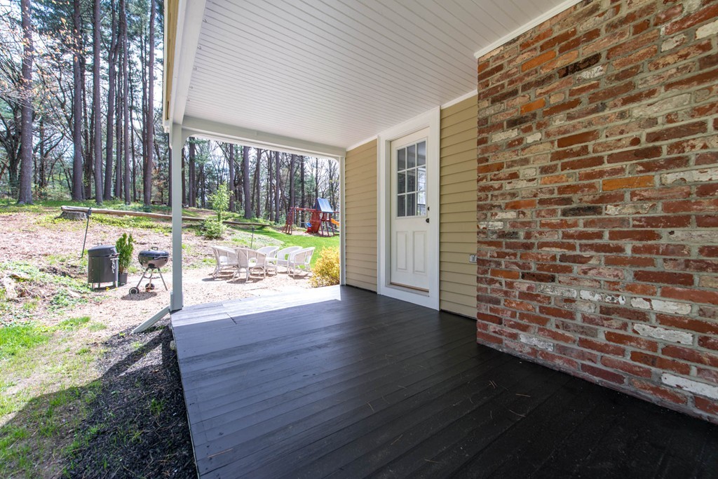 9 Legion Road Weston, MA 02493 - Photo 19 of 30 a view of outdoor space with wooden floor and a tub
