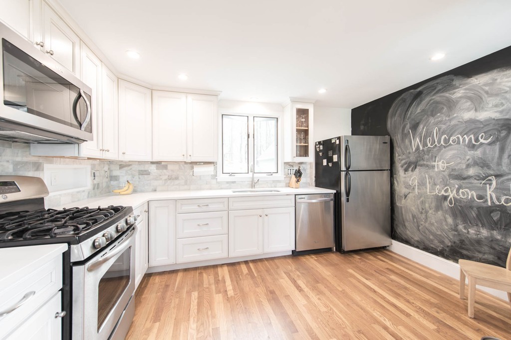 9 Legion Road Weston, MA 02493 - Photo 2 of 30 a kitchen with a sink stove and refrigerator