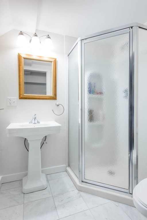 9 Legion Road Weston, MA 02493 - Photo 21 of 30 a bathroom with a sink a mirror and a shower