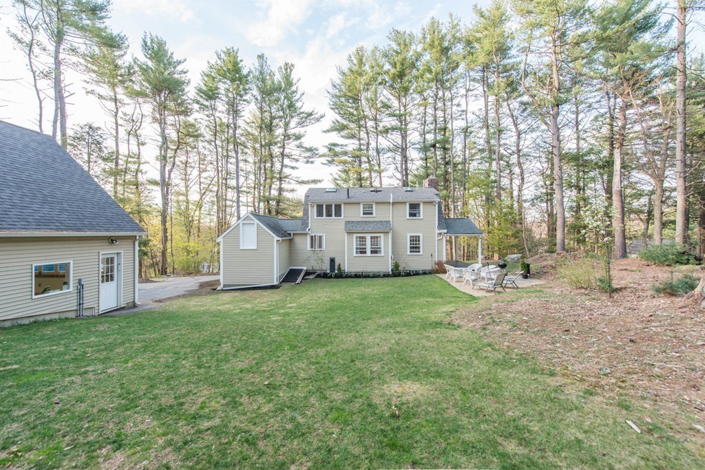 9 Legion Road Weston, MA 02493 - Photo 23 of 30 a view of a house with backyard and garden