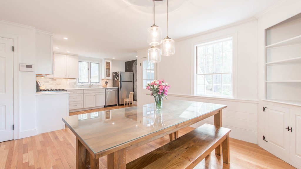 9 Legion Road Weston, MA 02493 - Photo 3 of 30 a kitchen with stainless steel appliances granite countertop counter space and windows
