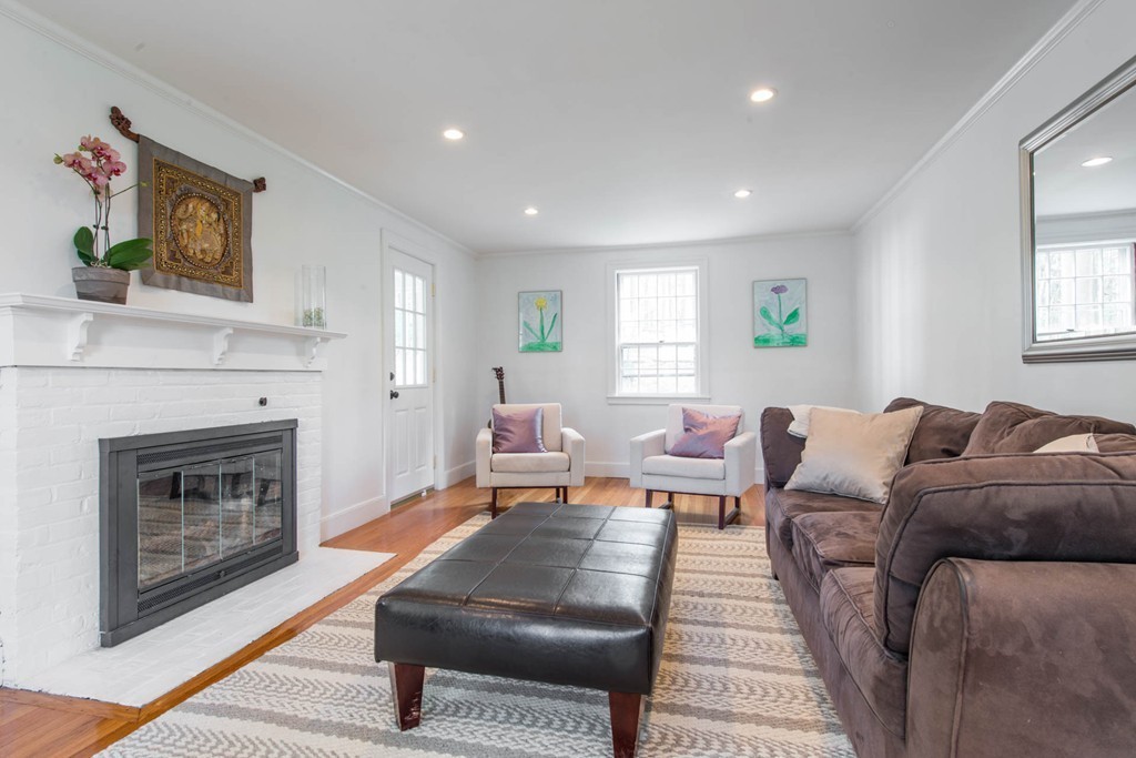 9 Legion Road Weston, MA 02493 - Photo 7 of 30 a living room with furniture and a fireplace