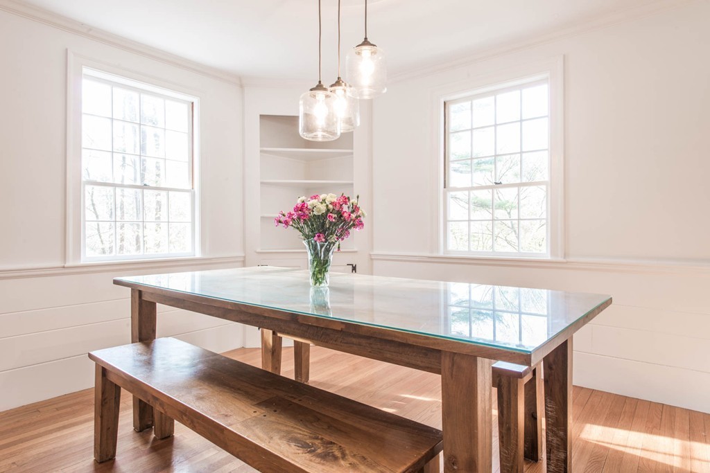 9 Legion Road Weston, MA 02493 - Photo 8 of 30 a dining room with table and chandelier