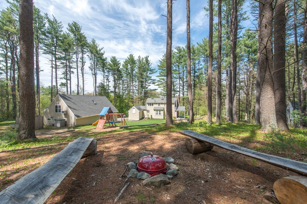9 Legion Road Weston, MA 02493 - Photo 9 of 30 a view of a park with large trees and a pathway