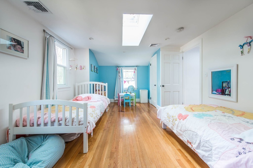 9 Legion Road Weston, MA 02493 - Photo 10 of 30 a bed room with a bed and a couch