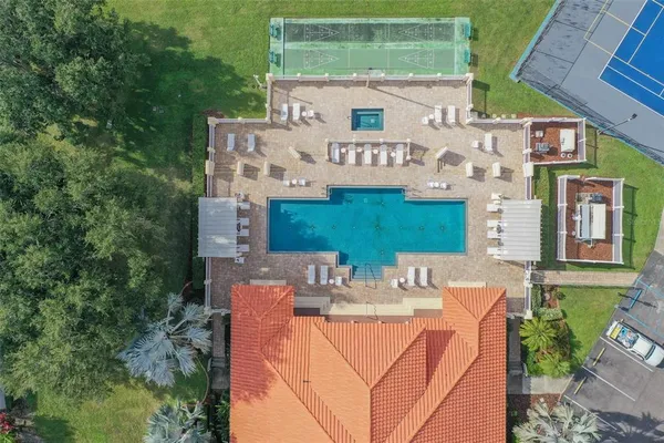 aerial view of a house with backyard porch and furniture
