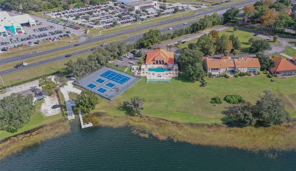 an aerial view of a house with garden space and street view