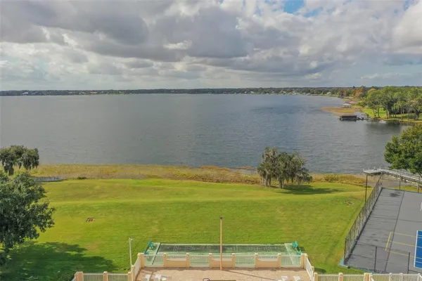 a view of a lake with a big yard