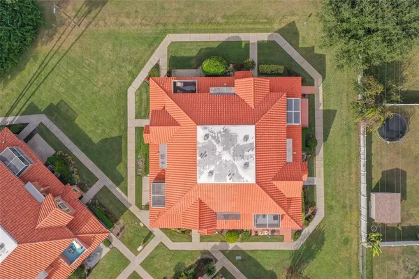 an aerial view of house with yard swimming pool and outdoor seating
