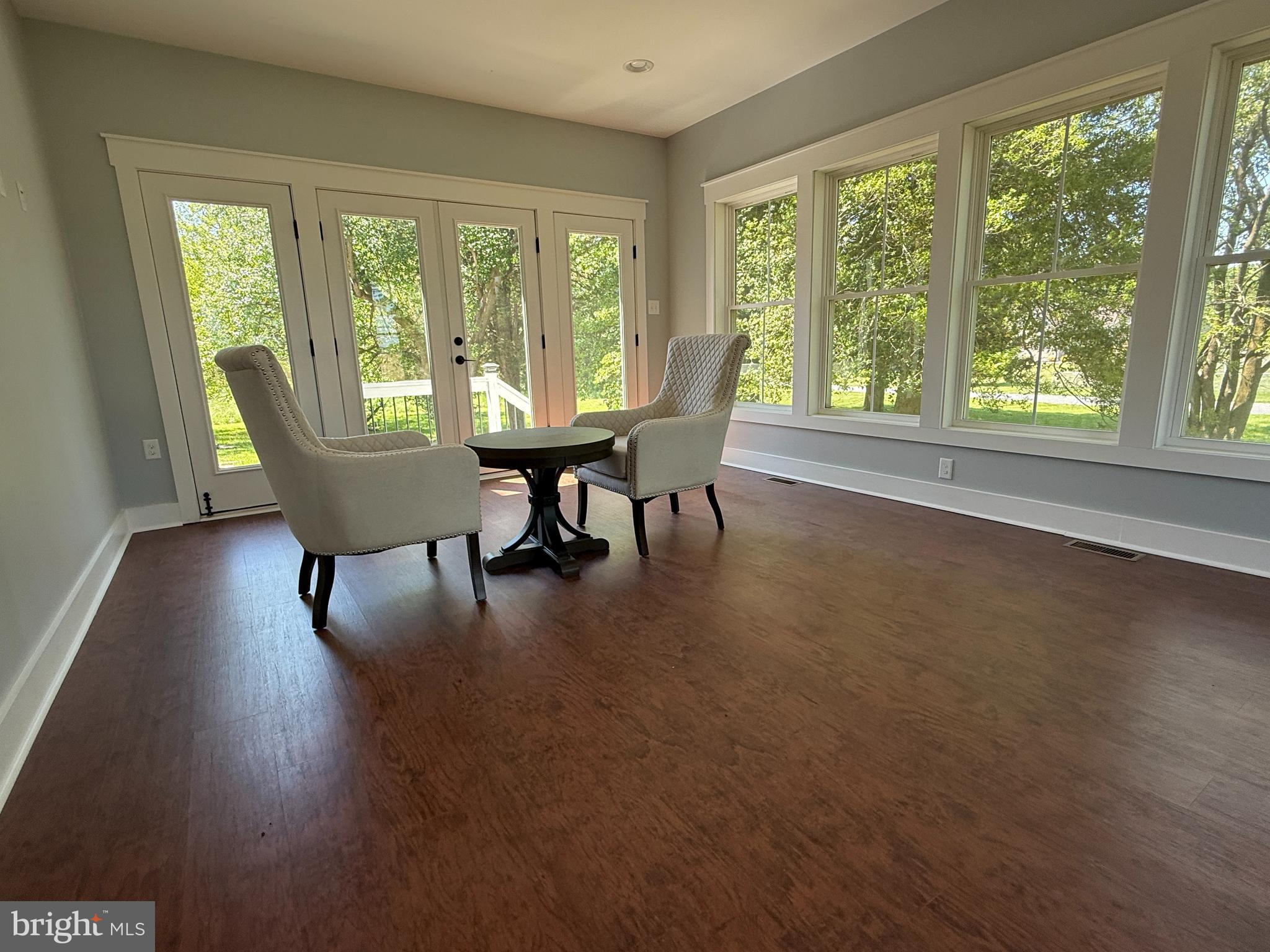 5482 Summit Bridge Road Townsend, DE 19734 - Photo 23 of 43 a dining room with furniture and wooden floor