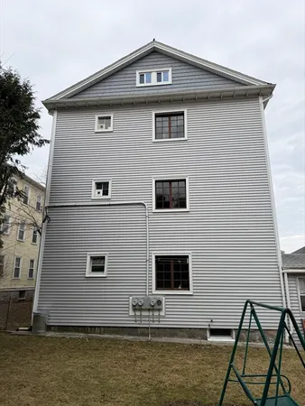 a front view of a house with parking area