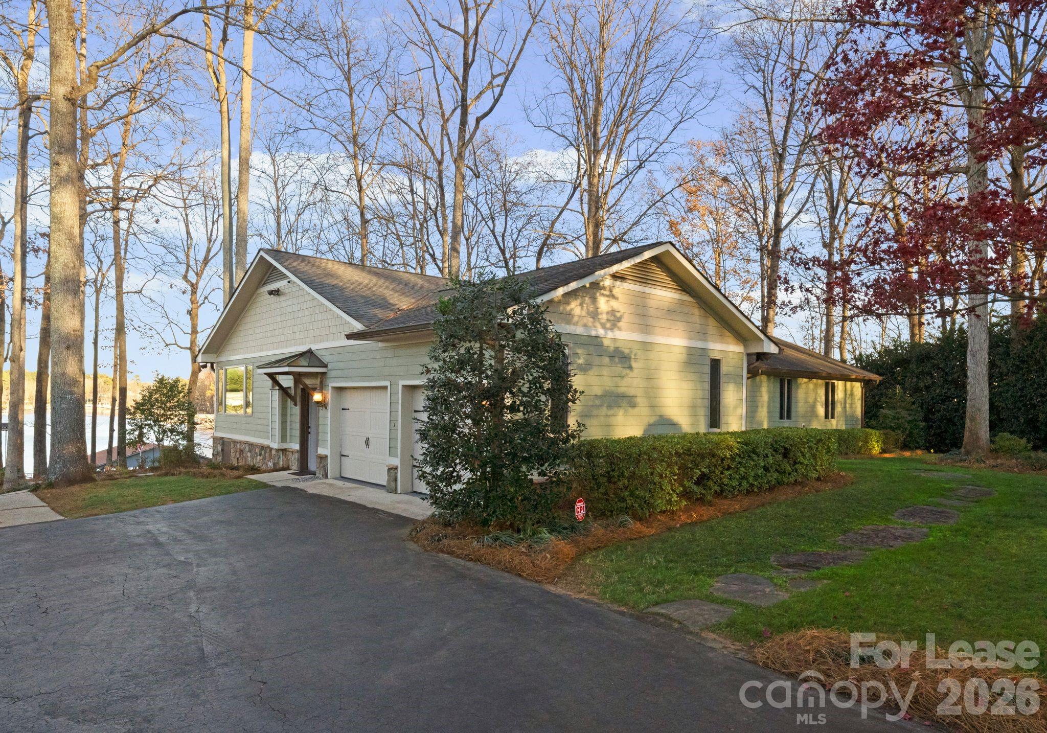 19709 Stough Farm Road Cornelius, NC 28031 - Photo 5 of 48 a view of a house with a yard and large trees