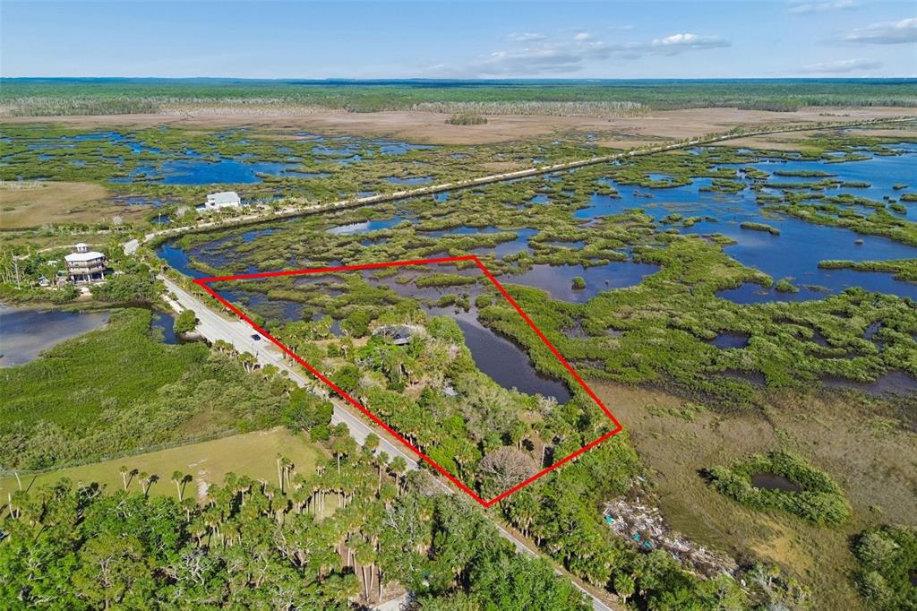 10501 Pine Island Drive Weeki Wachee, FL 34607 - Photo 2 of 54 a view of an ocean and beach