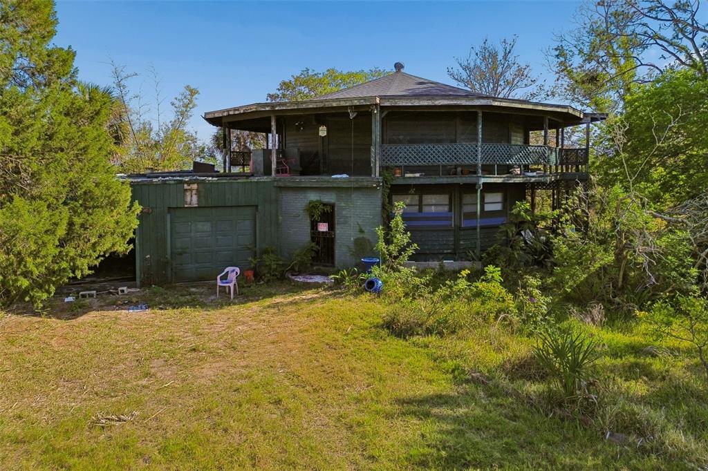 10501 Pine Island Drive Weeki Wachee, FL 34607 - Photo 26 of 54 a view of a house with yard and plants