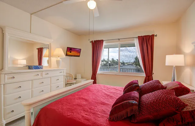 a bed room with a bed and a chandelier