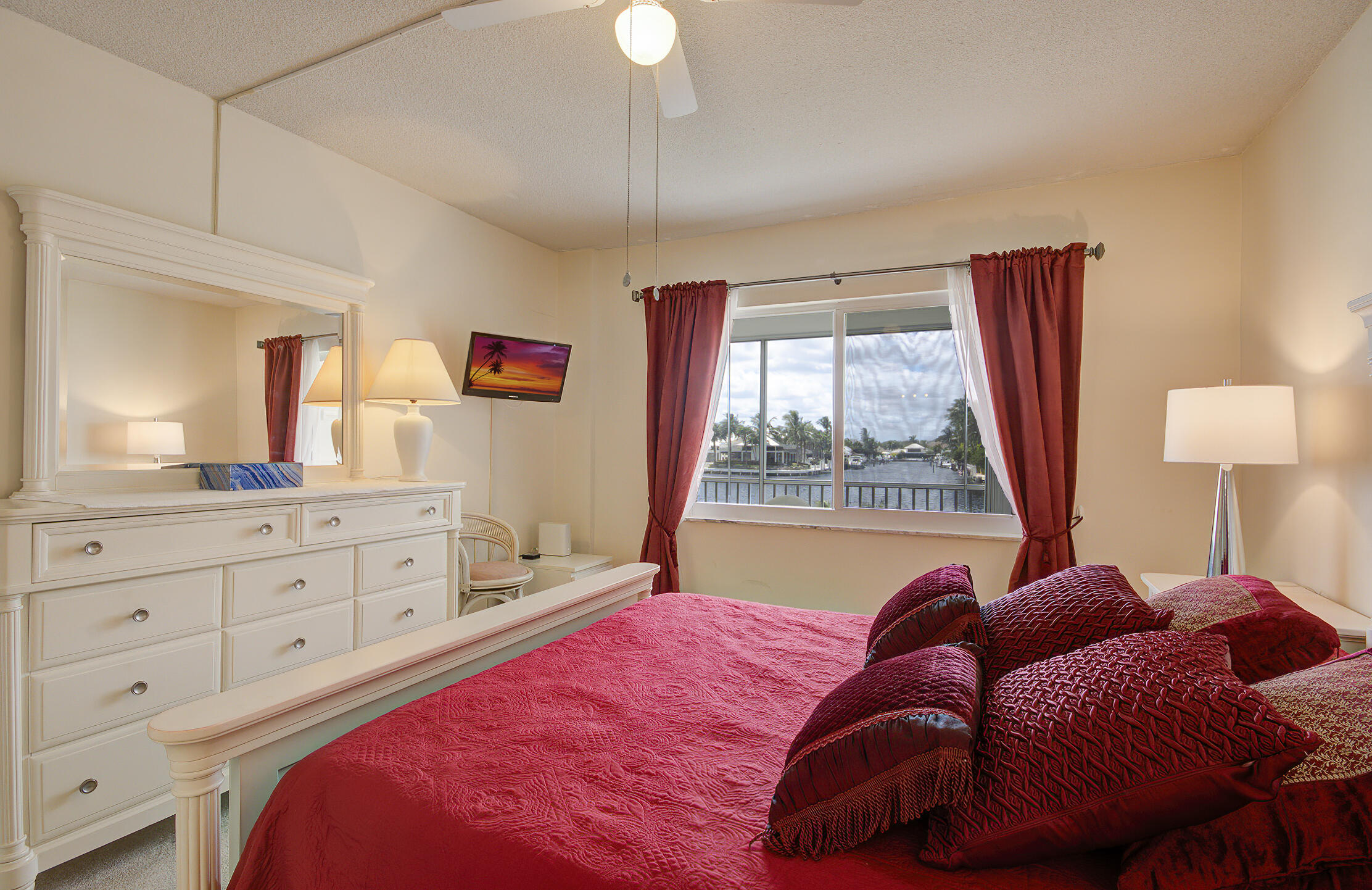 3100 South Ocean Boulevard, Unit 216 Highland Beach, FL 33487 - Photo 16 of 34 a bed room with a bed and a window